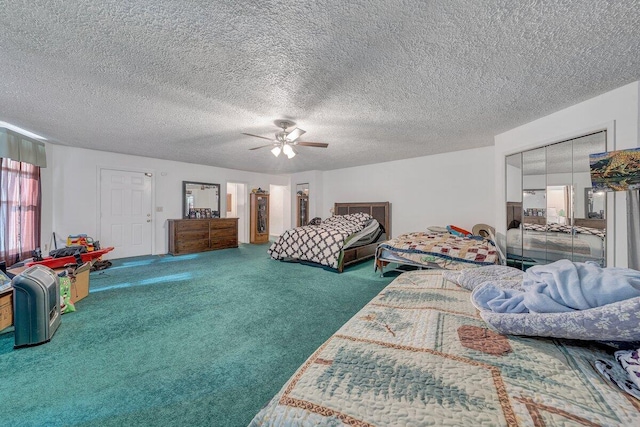 carpeted bedroom with ceiling fan and a textured ceiling