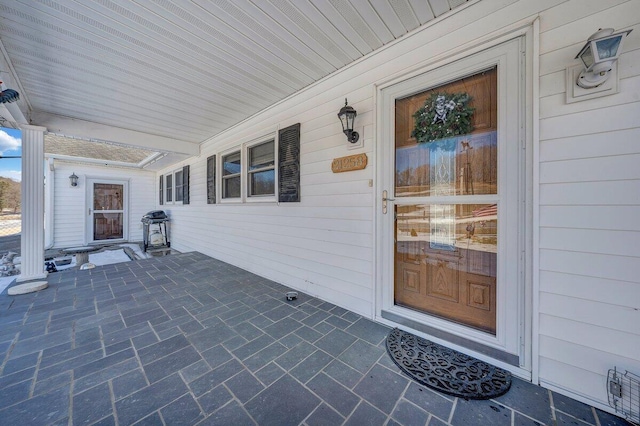 entrance to property with a porch