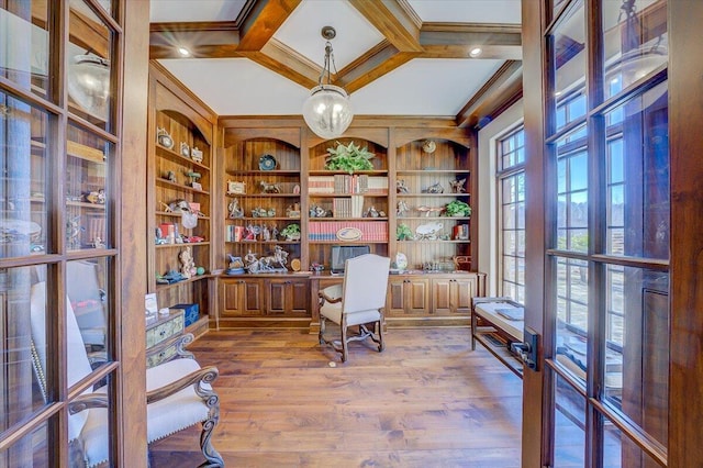 home office with french doors, wood-type flooring, coffered ceiling, and crown molding