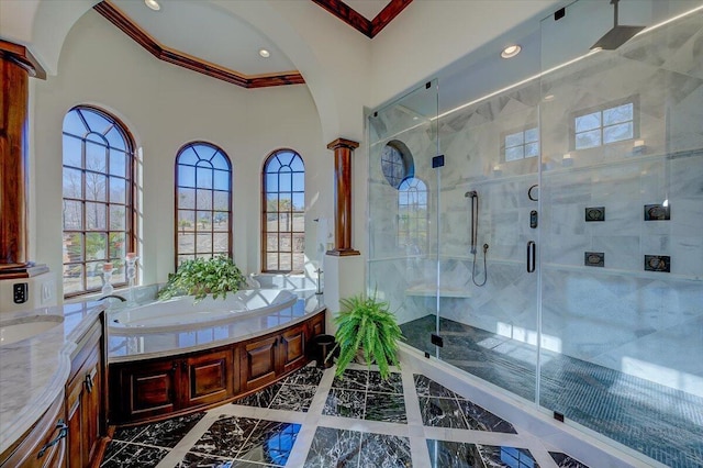 bathroom featuring vanity, crown molding, decorative columns, and independent shower and bath