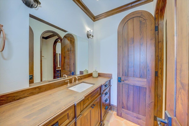 bathroom with vanity and ornamental molding