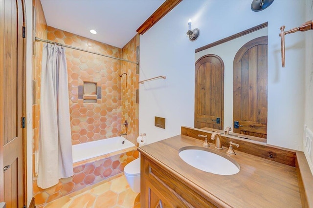 full bathroom featuring shower / tub combo, vanity, tile patterned floors, and toilet