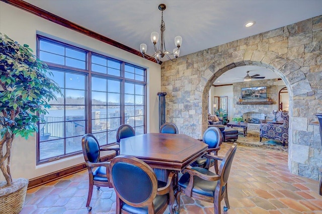 dining room featuring a notable chandelier, plenty of natural light, and ornamental molding