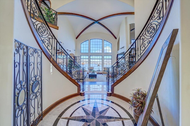 foyer entrance with a high ceiling