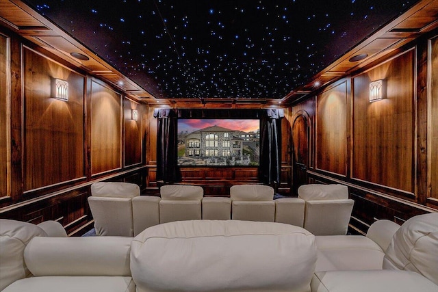 home theater room featuring wooden walls