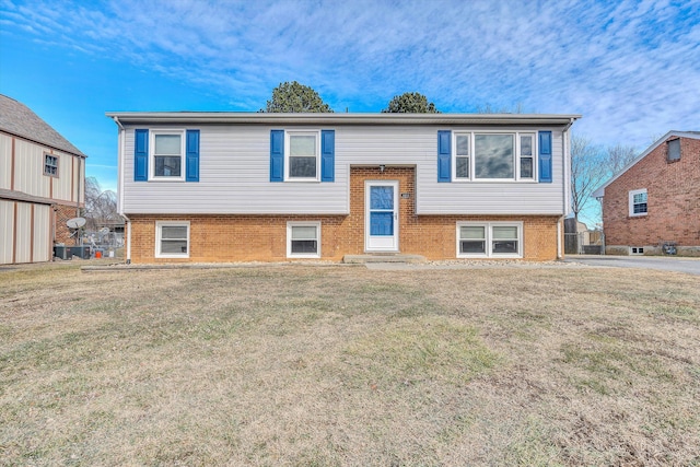 raised ranch featuring a front yard