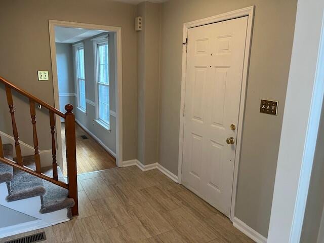 entrance foyer with hardwood / wood-style floors