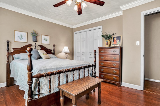 bedroom with crown molding, ceiling fan, dark hardwood / wood-style floors, and a closet