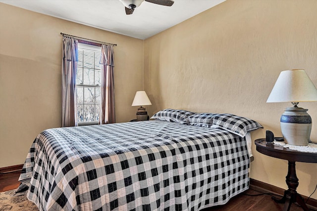 bedroom featuring dark hardwood / wood-style floors and ceiling fan