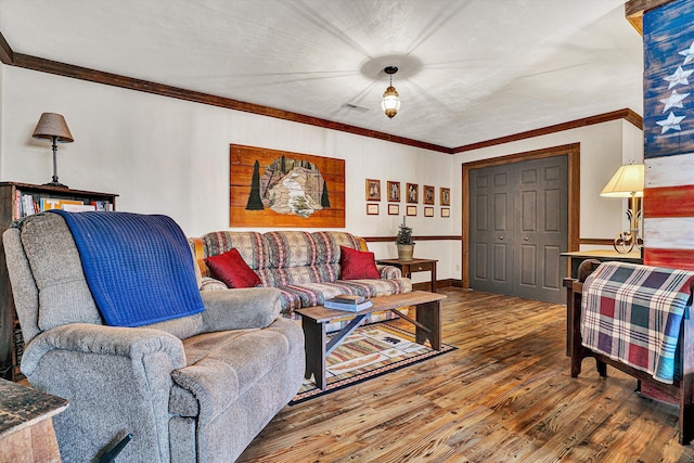 living room featuring crown molding and wood-type flooring