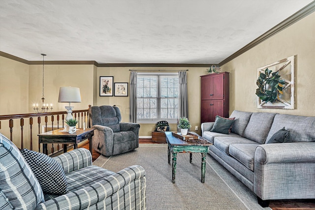 living room featuring a notable chandelier, crown molding, and hardwood / wood-style flooring