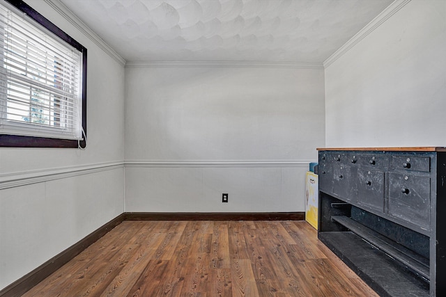 unfurnished room with dark wood-type flooring and ornamental molding