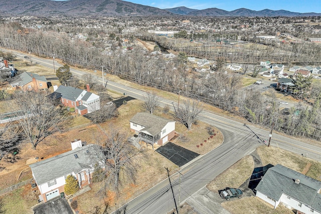 birds eye view of property with a mountain view