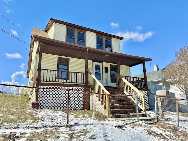 view of front of house with a porch and fence