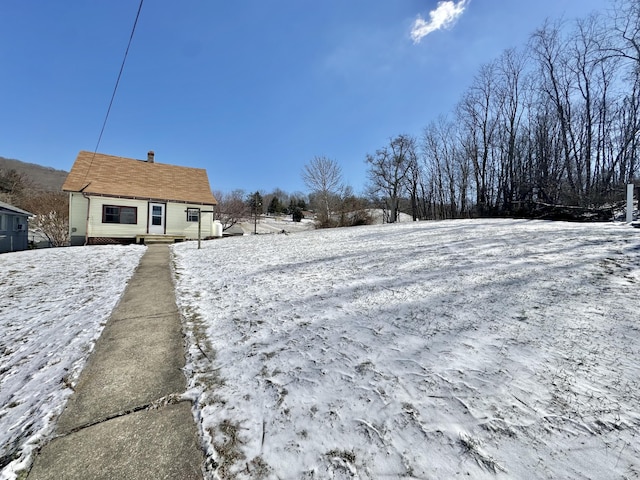 view of yard layered in snow