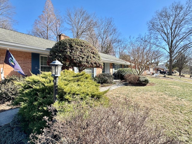 view of property exterior with a lawn