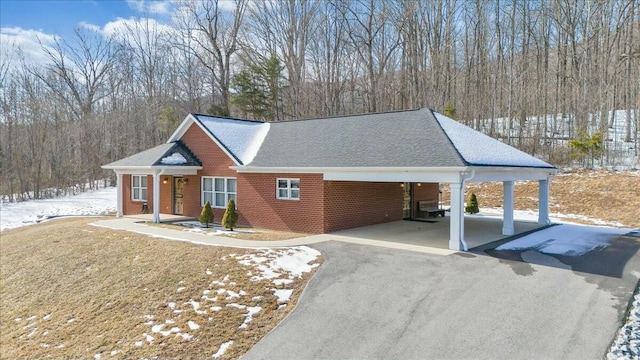 view of front of home with a carport