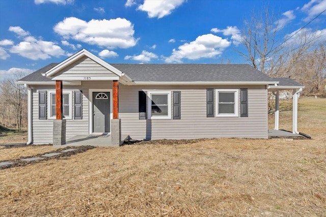 view of front of house with a front lawn and covered porch