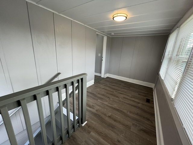 hallway with dark hardwood / wood-style floors