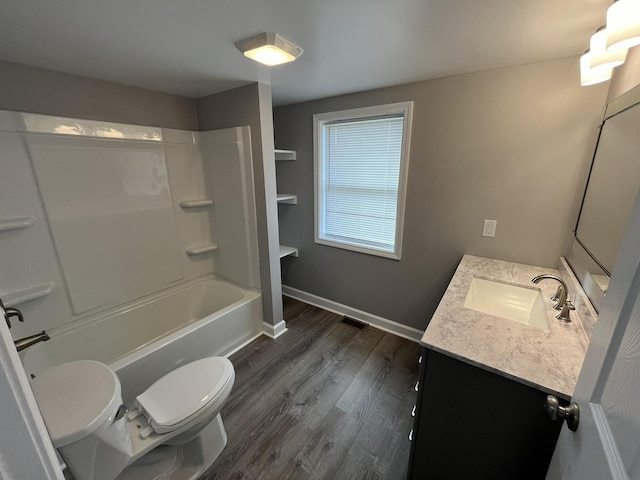 full bathroom featuring hardwood / wood-style flooring, shower / bathtub combination, vanity, and toilet