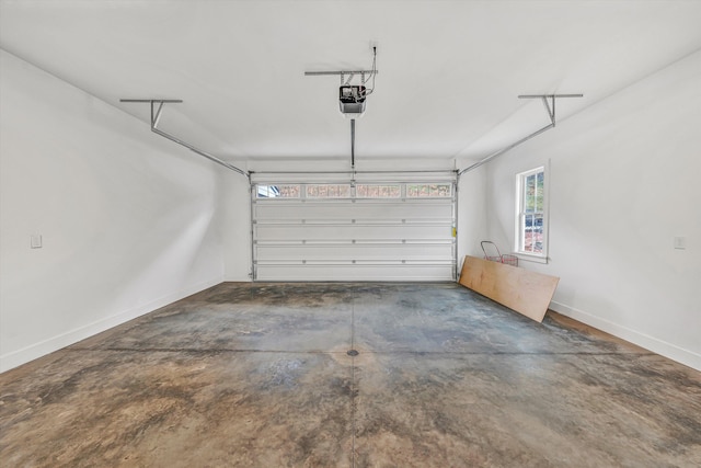 garage featuring baseboards and a garage door opener