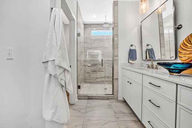 full bathroom with a shower stall, marble finish floor, and vanity