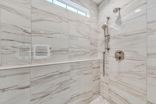 full bathroom featuring tiled shower