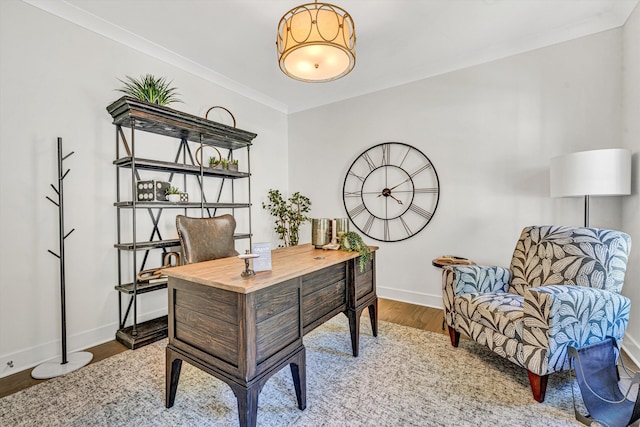 office featuring crown molding, baseboards, and wood finished floors