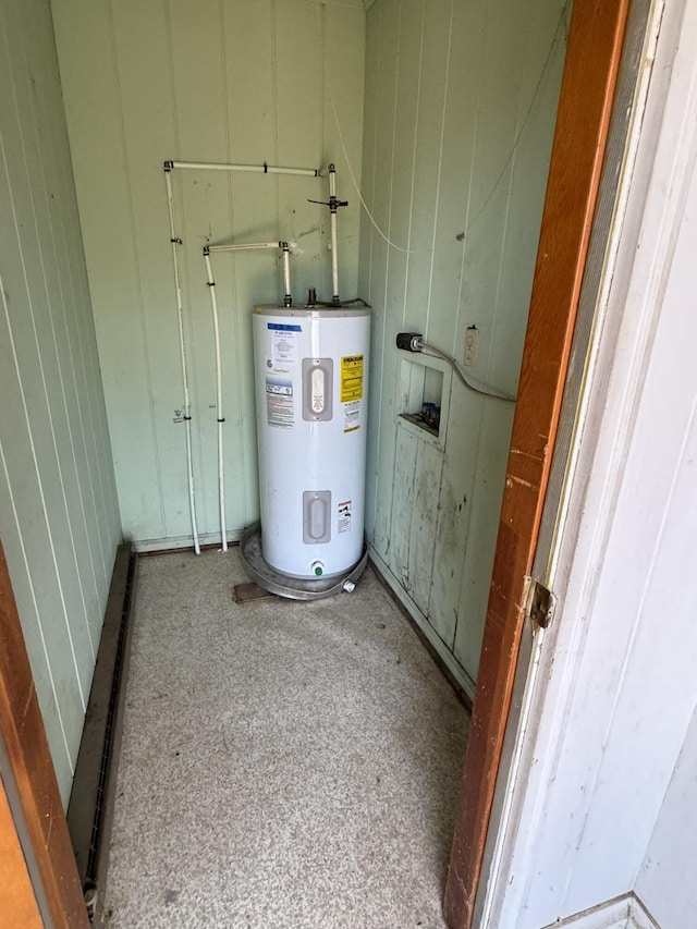 utility room with electric water heater