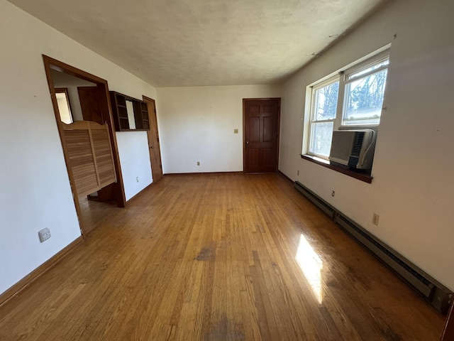 1075 Windstar Cir, Vinton, VA 24179 - empty room featuring a baseboard heating unit, wood finished floors, baseboards, and cooling unit