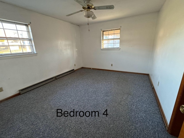 empty room with carpet floors, a baseboard heating unit, and ceiling fan