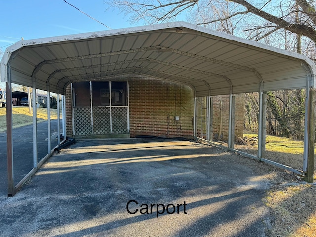 view of vehicle parking featuring a carport