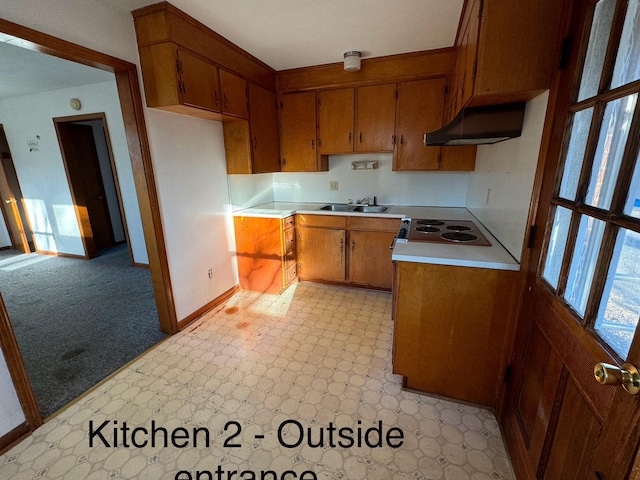 1075 Windstar Cir, Vinton, VA 24179 - kitchen featuring under cabinet range hood, brown cabinets, electric cooktop, baseboards, and light countertops