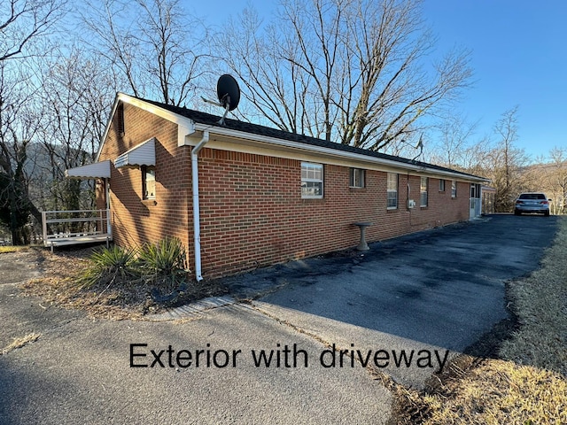 1075 Windstar Cir, Vinton, VA 24179 - view of side of home with brick siding and driveway