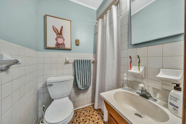 bathroom featuring tile walls, tile patterned flooring, vanity, ornamental molding, and toilet