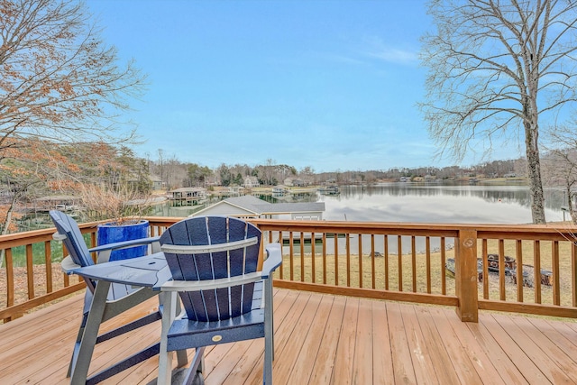 wooden terrace featuring a water view