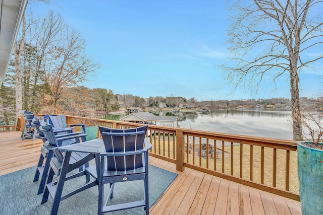 wooden terrace featuring a water view