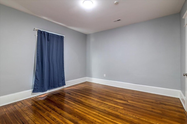 empty room with wood-type flooring