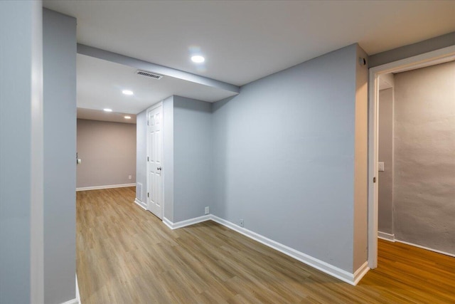 basement featuring light wood-type flooring