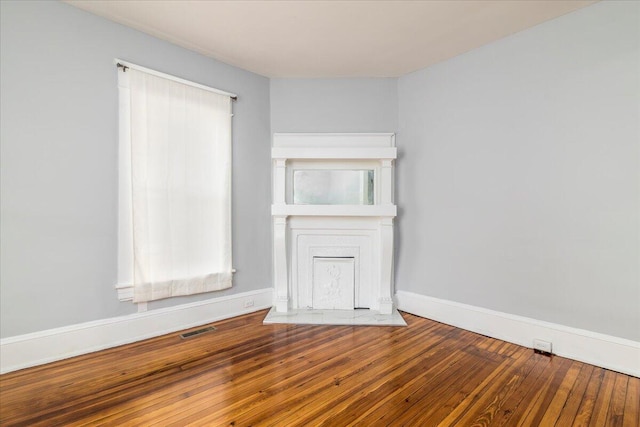 spare room with hardwood / wood-style floors