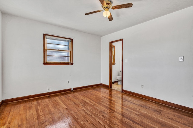 empty room featuring hardwood / wood-style flooring and ceiling fan