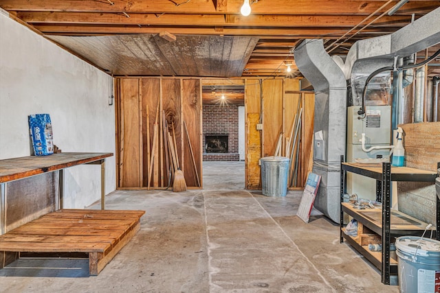 basement featuring a brick fireplace