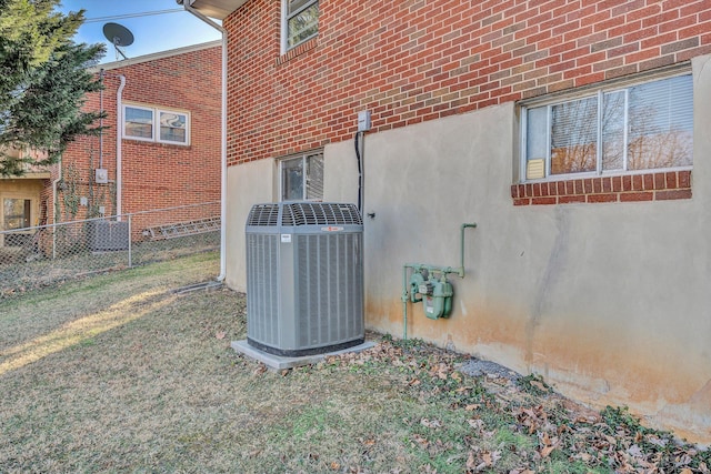 view of side of home featuring central AC