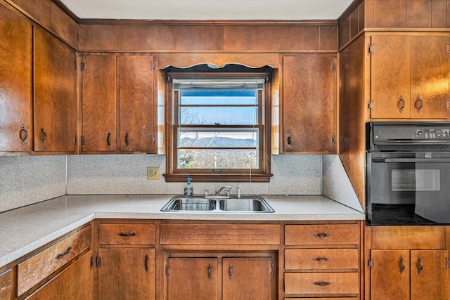 kitchen featuring sink and oven