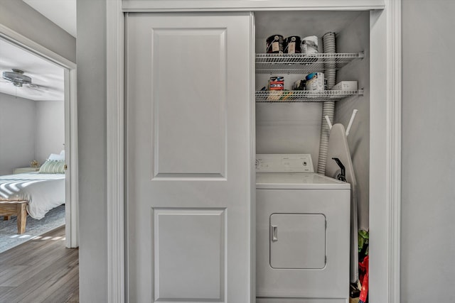 washroom featuring washer / dryer and light hardwood / wood-style flooring