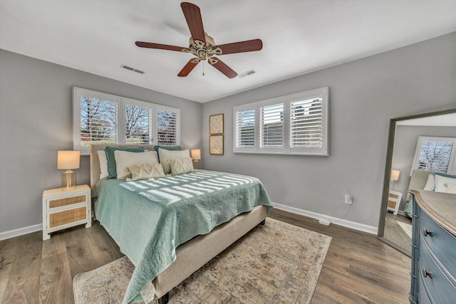 bedroom featuring ceiling fan and dark hardwood / wood-style floors