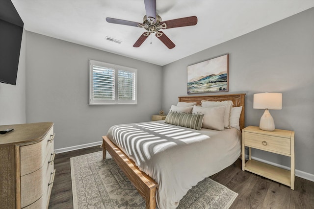 bedroom featuring ceiling fan and dark hardwood / wood-style flooring