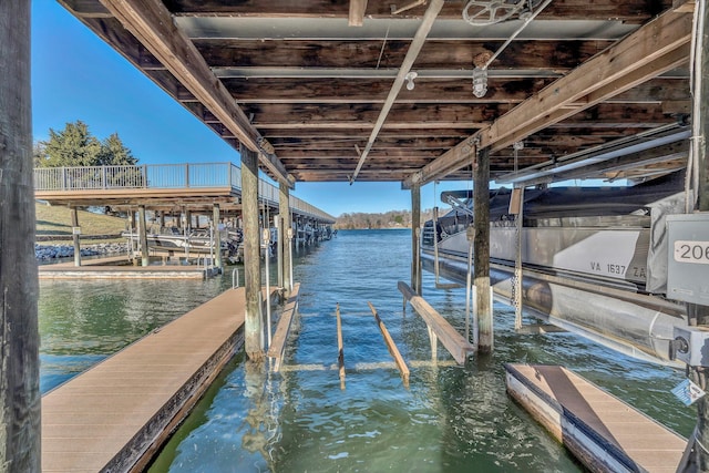 dock area featuring a water view