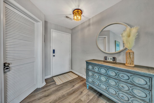 entryway with hardwood / wood-style flooring