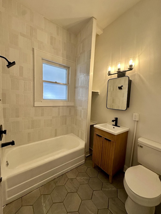 full bathroom with toilet, tile patterned flooring, tub / shower combination, and vanity